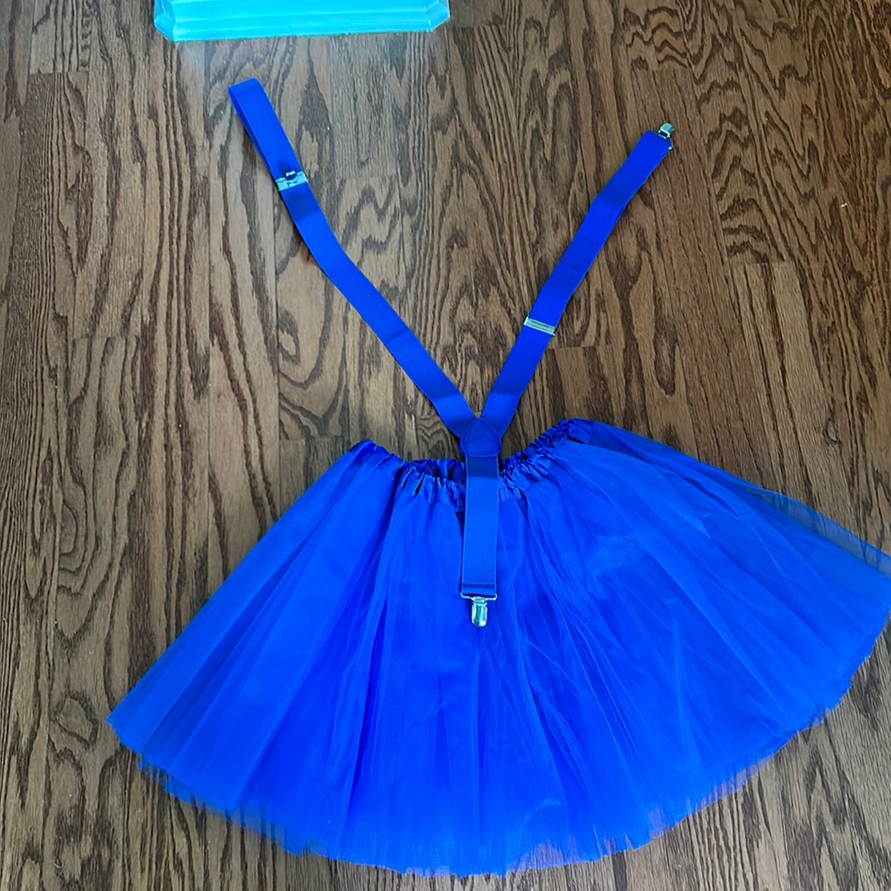 Blue tule skirt with matching overalls. One size fits most